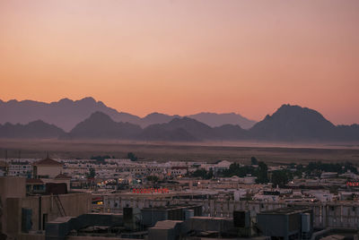 High angle view of townscape against sky at sunset