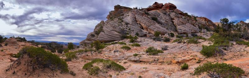 Panoramic view of rock formations against sky