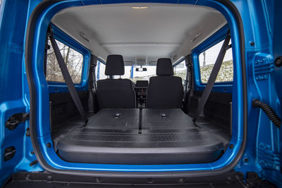 Open car trunk with seats folded into flat flor of suv crossover