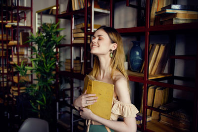 Young woman looking at book