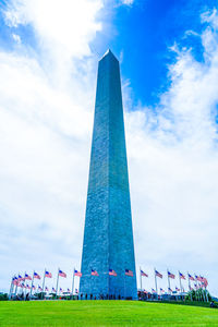 Low angle view of monument against cloudy sky