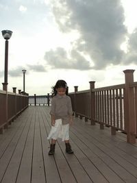 Full length of woman standing on road