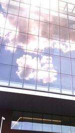 Low angle view of sky seen through glass window