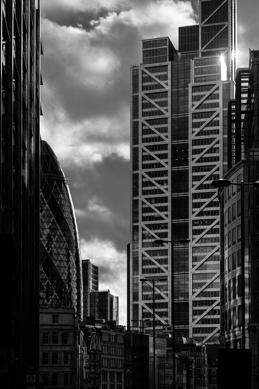 architecture, building exterior, built structure, sky, cloud - sky, city, cloudy, building, cloud, window, low angle view, residential building, residential structure, day, modern, outdoors, city life, no people, office building, glass - material