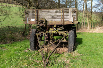 Abandoned vehicle on field