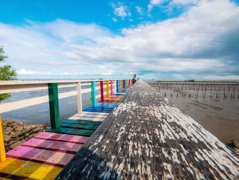 Pier over sea against sky