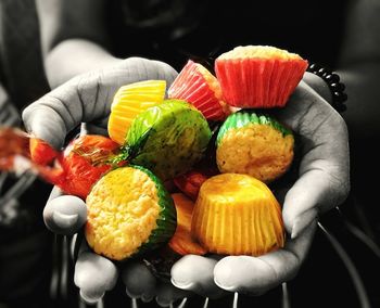 Close-up of hand holding fruits