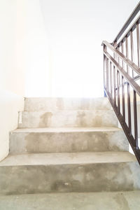 Low angle view of staircase in building against sky