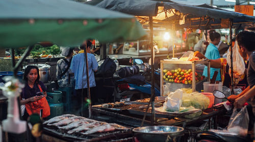 People at market stall