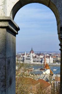 Bridge over river with buildings in background