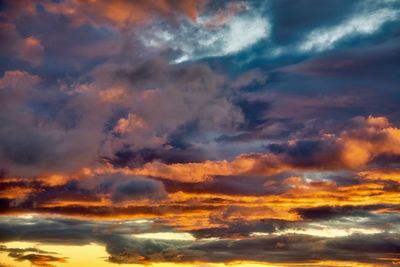 Low angle view of dramatic sky during sunset