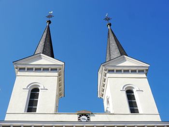 Low angle view of church against blue sky