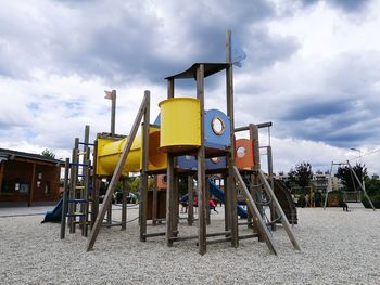 Playground in park against sky