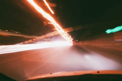 Illuminated road at night