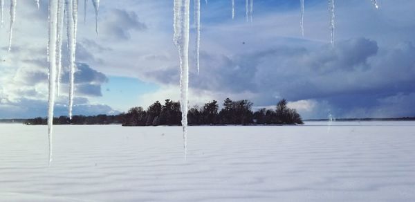 Close-up of frozen lake against sky