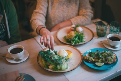 Midsection of woman having food