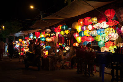 Illuminated lanterns in market at night