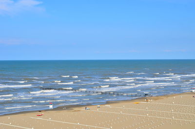 Scenic view of sea against blue sky