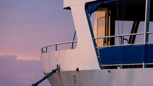 Low angle view of ship against sky during sunset
