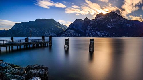 Scenic view of snowcapped mountains against sky during sunset