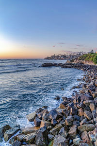 Scenic view of sea against sky at sunset