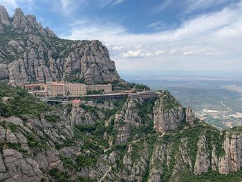 Scenic view of mountain against cloudy sky