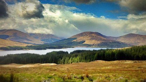 Scenic view of landscape and mountains against sky