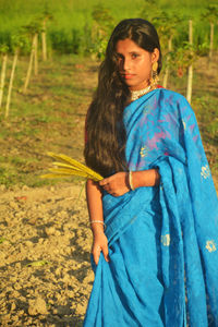 Portrait of girl wearing sari standing outdoors