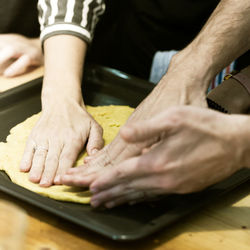 Midsection of man preparing food