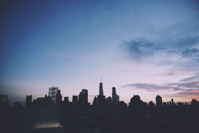 Silhouette of city at sunset