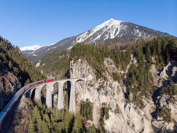 Panoramic shot of mountain road against clear sky