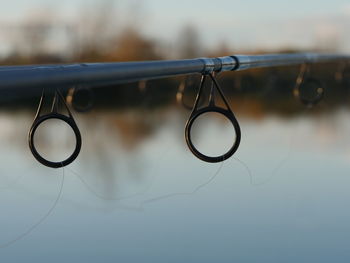 Close-up of sunglasses against sky