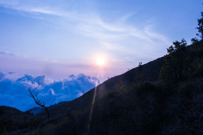 Scenic view of mountains against sky during sunset