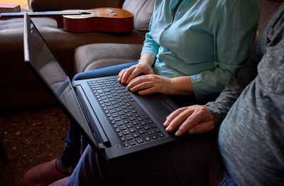 Close-up of husband and wife having an online conversation