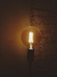 Low angle view of illuminated light bulb