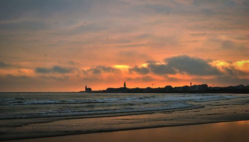 Scenic view of sea against sky during sunset