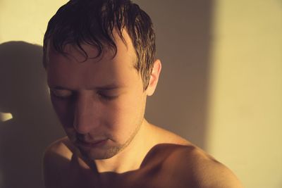 Close-up of shirtless young man