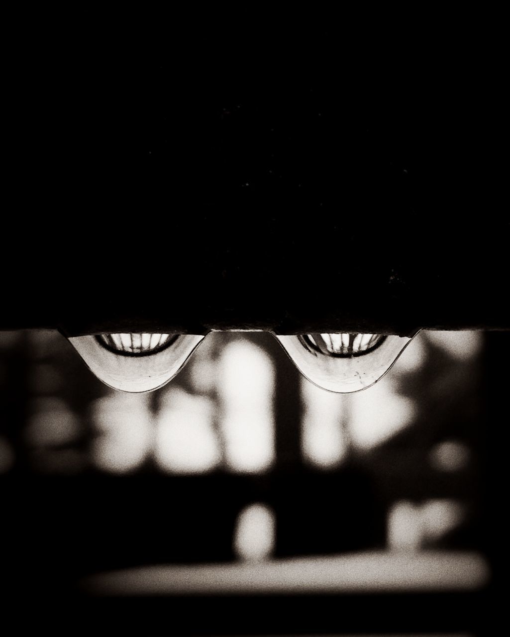 close-up, indoors, illuminated, lighting equipment, dark, copy space, reflection, night, electricity, focus on foreground, light bulb, glass - material, darkroom, no people, black color, selective focus, transparent, electric light, single object, technology