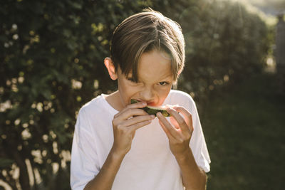 Portrait of boy eating food