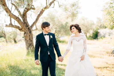 Couple holding hands in park