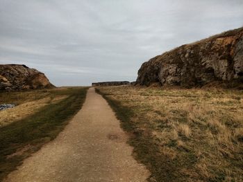 Dirt road passing through landscape