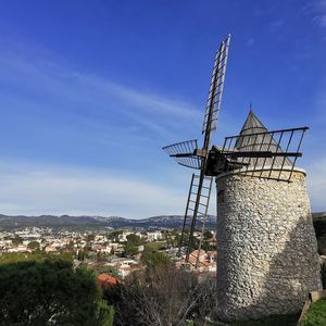 Traditional windmill against sky