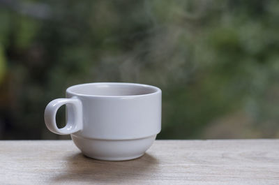 Close-up of coffee cup on table