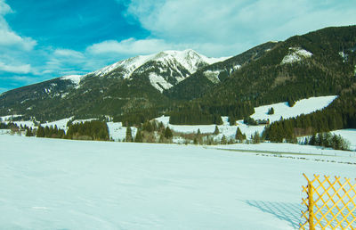 Scenic view of snowcapped mountains against sky