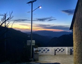 Scenic view of mountains against sky at sunset