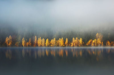 Scenic view of lake against sky during autumn