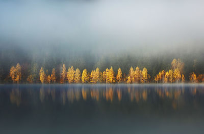 Scenic view of lake against sky during autumn