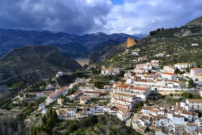 Town against cloudy sky