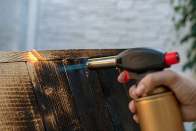 Close-up of hand holding drink