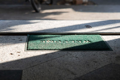 High angle view of text on footpath